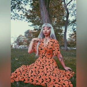 WAX POETIC AURORA WRAP DRESS IN ORANGE QUEEN OF HALLOWEEN SPARKLE FLOCKED MESH S